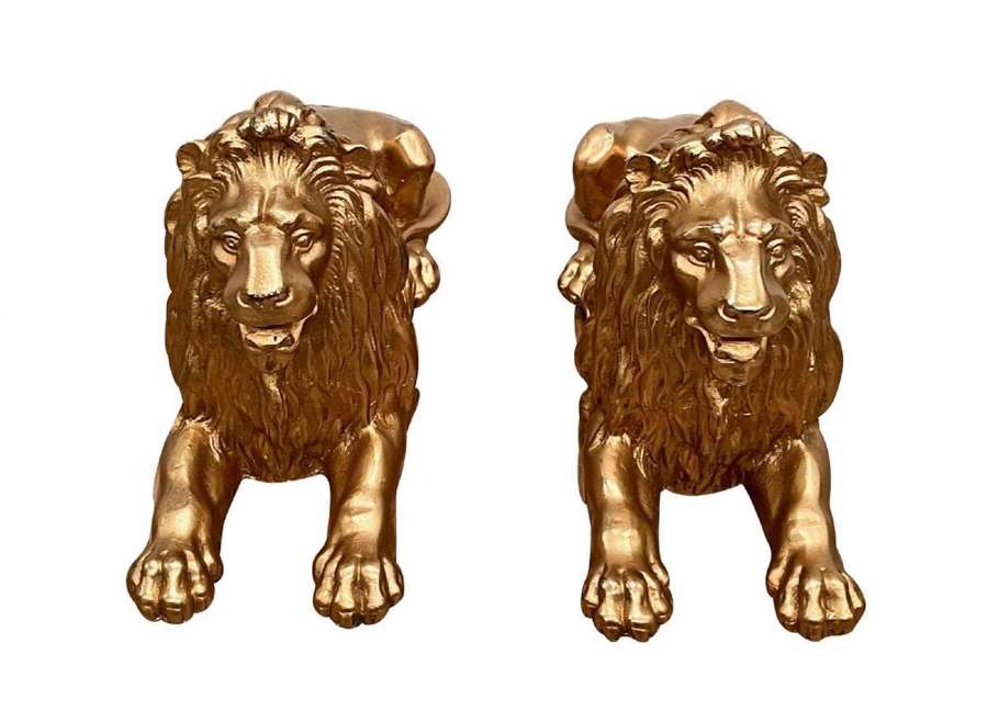 A pair of cast iron Landseer lions