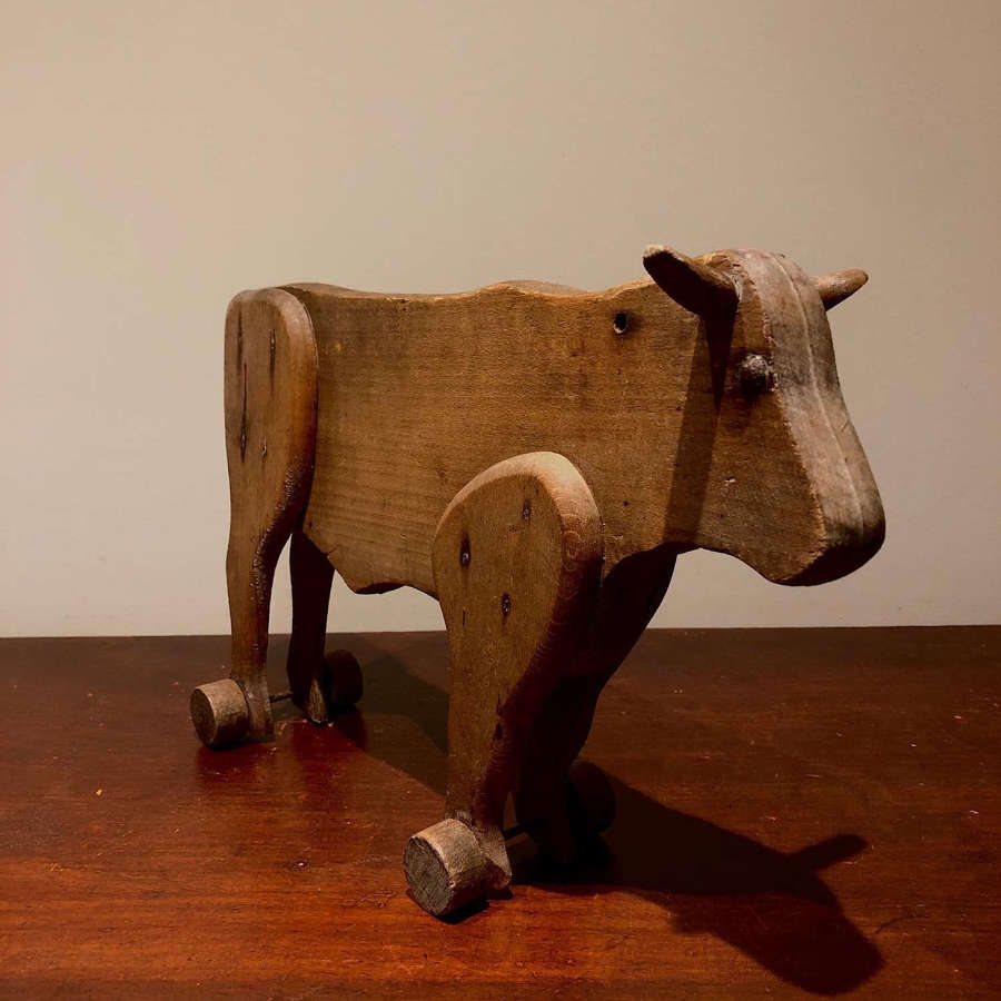 A Folk Art Toy Pull Along Bull