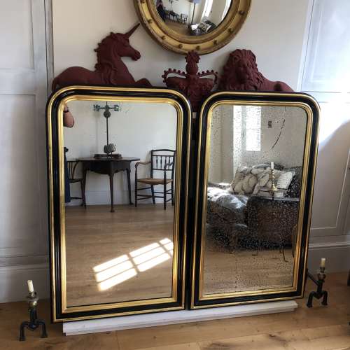 A pair of Napoleon III overmantel mirrors