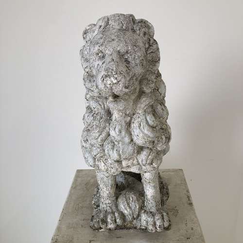 A cast stone garden lion