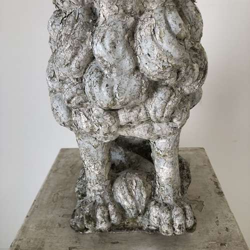 A cast stone garden lion