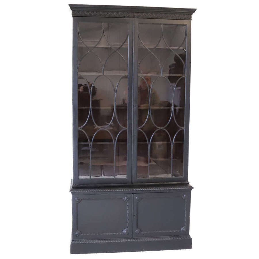 An ebonised Glazed bookcase