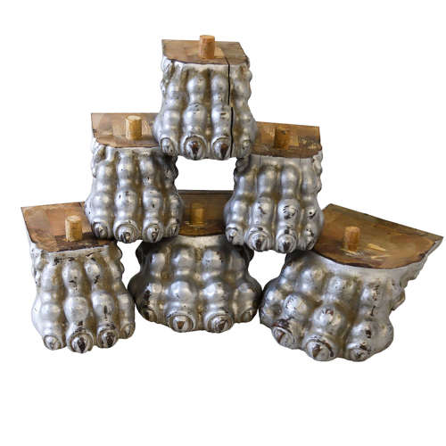 Six large lion paw feet