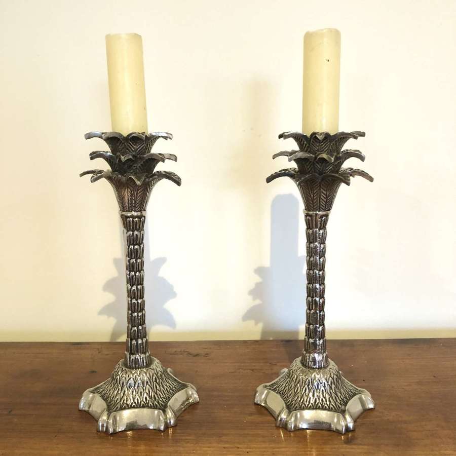 A pair of Palm Tree Candle Sticks