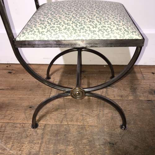 A pair of steel and brass side chairs