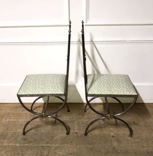 A pair of steel and brass side chairs