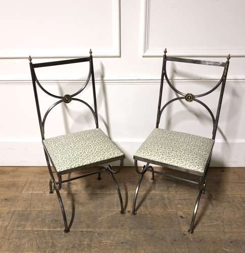 A pair of steel and brass side chairs