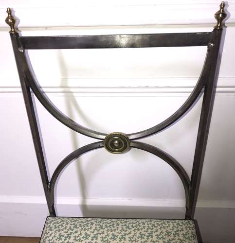 A pair of steel and brass side chairs