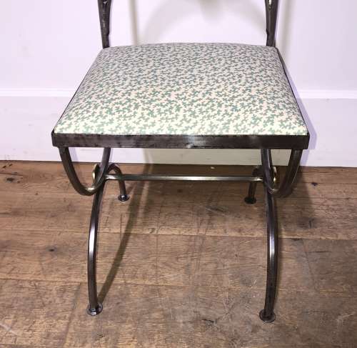 A pair of steel and brass side chairs