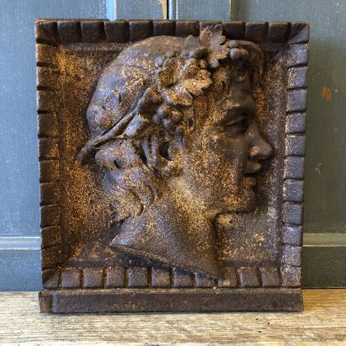 A pair of iron plaques